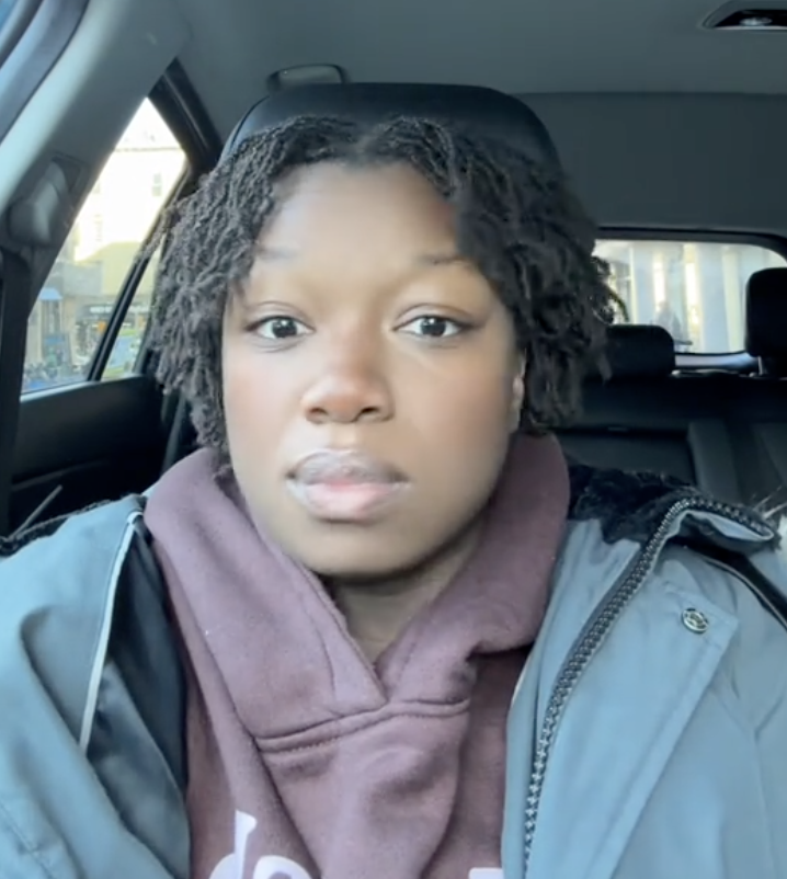 woman sitting in her car